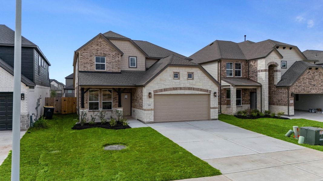 Front exterior of a new home in Barton Creek Ranch, Conroe, TX, highlighting curb appeal (Image 16). Front exterior of a new home in Barton Creek Ranch, Conroe, TX, highlighting curb appeal (Image 16).