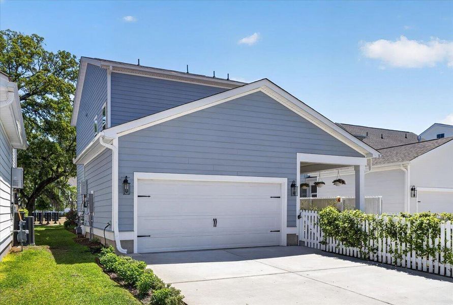 Front exterior of a new home in Oak Bluff, Charleston, SC, highlighting curb appeal (Image 25).
