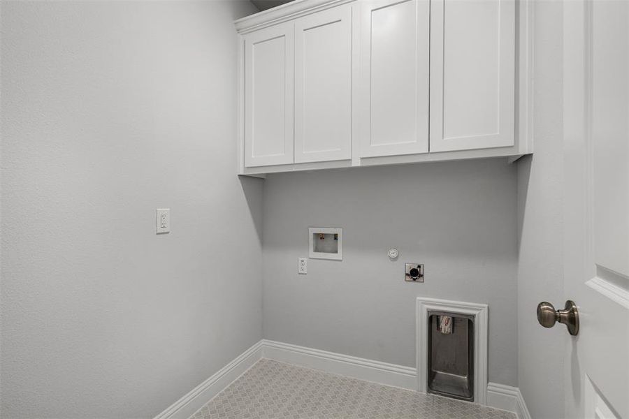 Tons of Cabinets in Laundry Room!