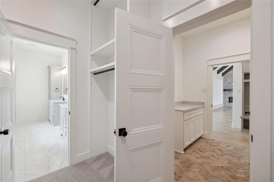 Spacious closet with light hardwood / wood-style floors