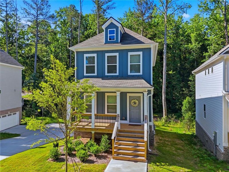 Front exterior of a new home in , Woodstock, GA, highlighting curb appeal (Image 1). Front exterior of a new home in , Woodstock, GA, highlighting curb appeal (Image 1).