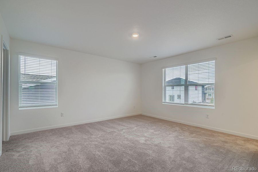 Spacious, unfurnished interior of a new home in Eastcreek Farm: The Camden Collection, Thornton (Image 9).