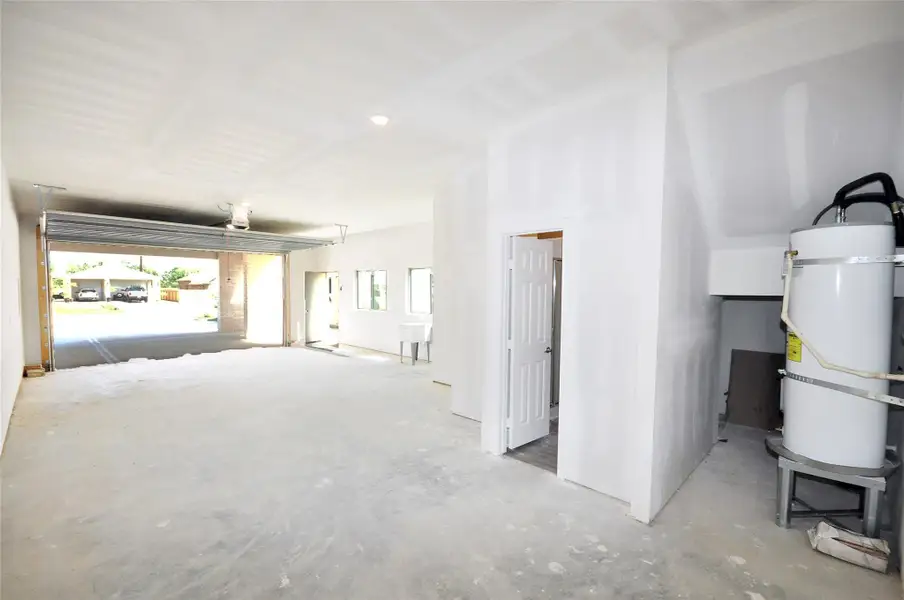 Notice the extra water heater which serves the 2 large garages.