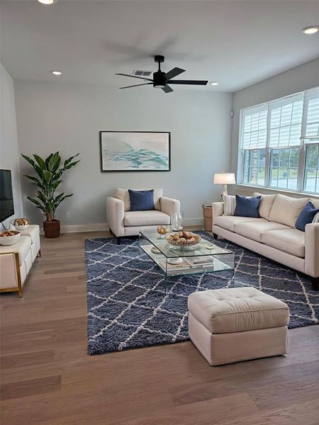 Living room featuring recessed lighting, wood finished floors, and ceiling fan