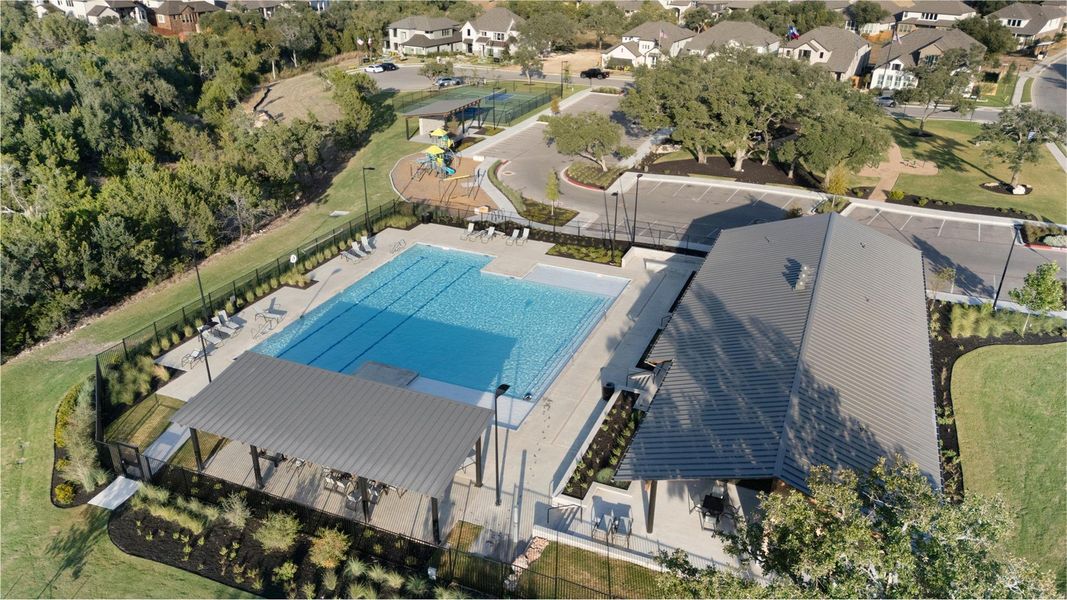 Aerial perspective of suburban area featuring a pool area