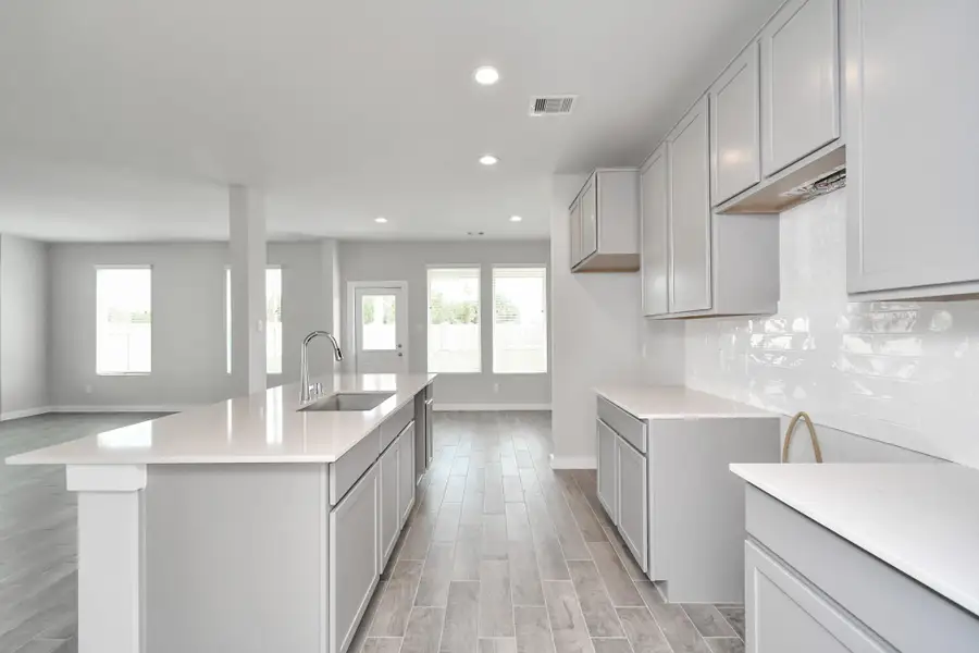 This generously spacious kitchen is a dream realized! Sample photo of completed home with similar floor plan. Actual colors and selections may vary.