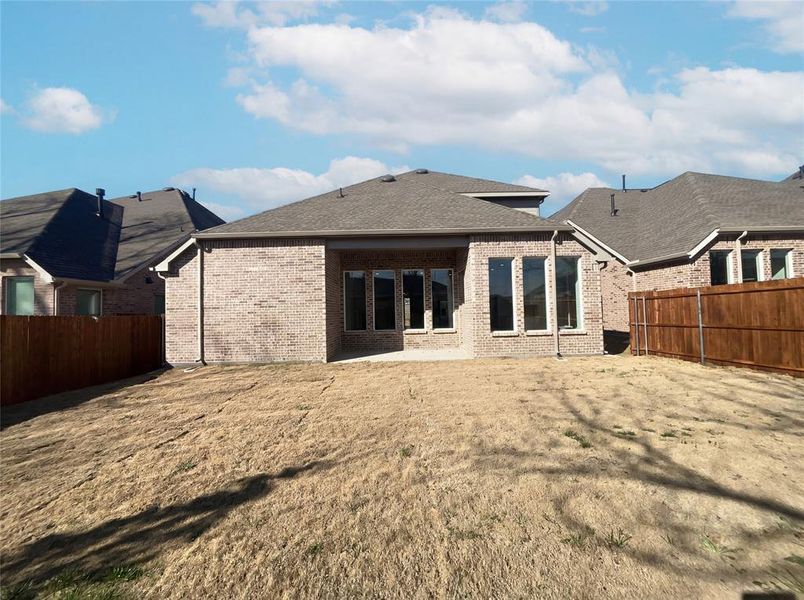 Exterior details and patio area of a home in Shaded Tree, McKinney (Image 19).