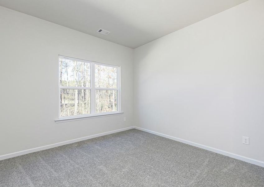 Unwind after a long day in this incredible master bedroom