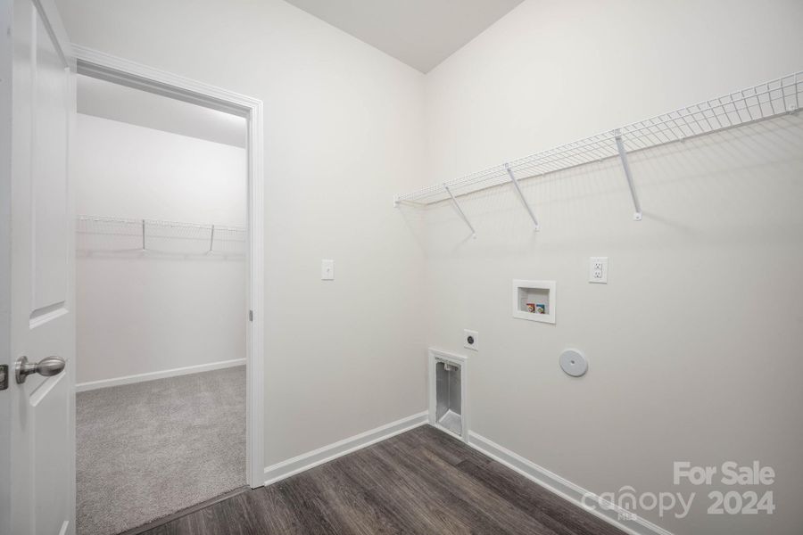 Laundry room with shelving