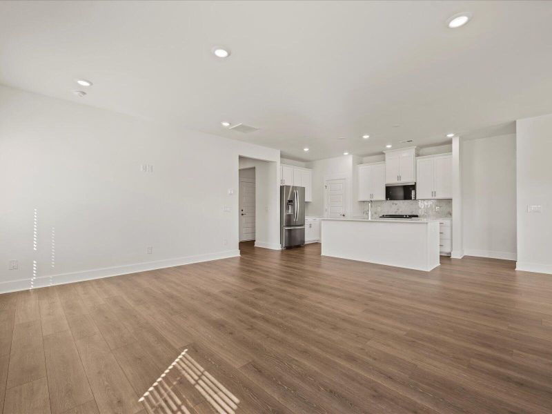 Spacious, unfurnished interior of a new home in The Coves at Lakes of Cane Bay, Summerville (Image 38).
