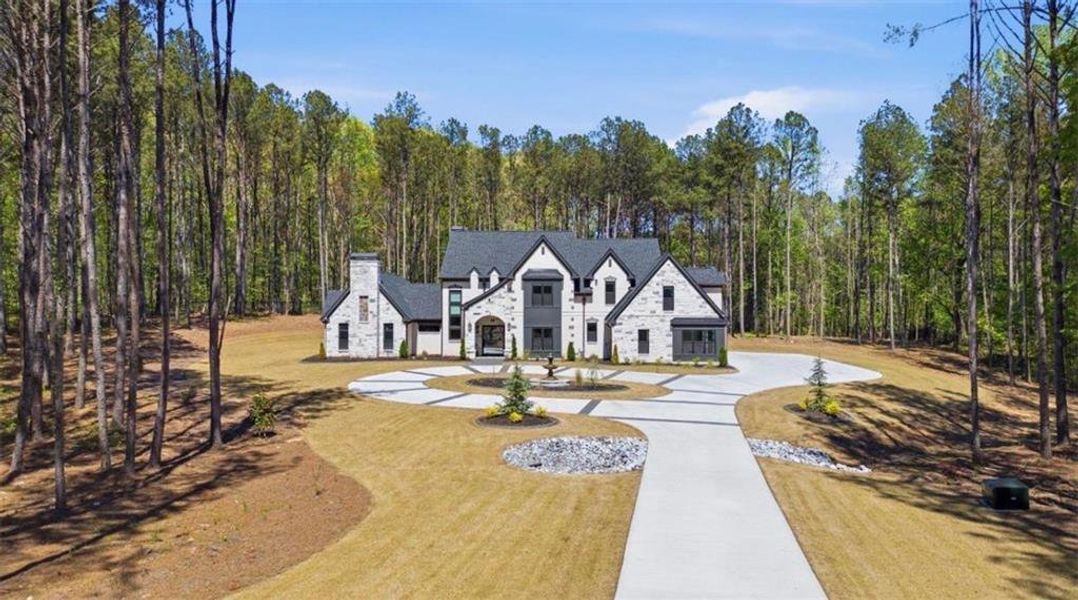 Front exterior of a new home in , Tyrone, GA, highlighting curb appeal (Image 27).