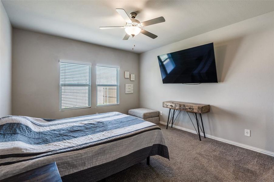Bedroom with carpet and ceiling fan