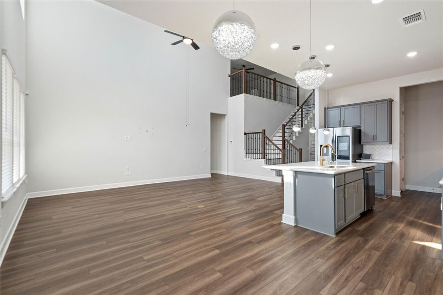 High ceilings and modern wood floors define this open main-level living space.