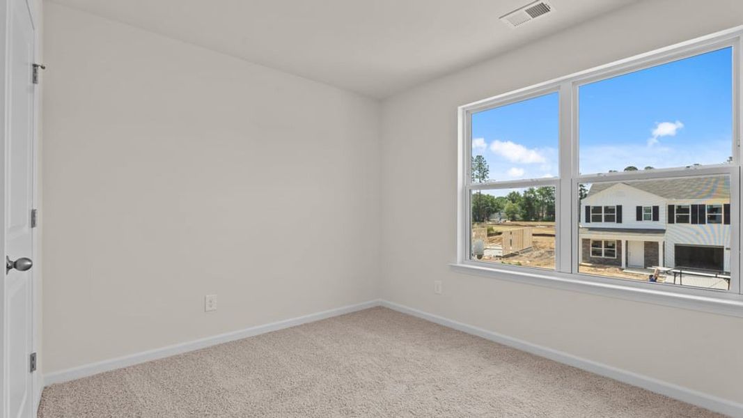 Spacious, unfurnished interior of a new home in Hobbs Farm, Ayden (Image 28).