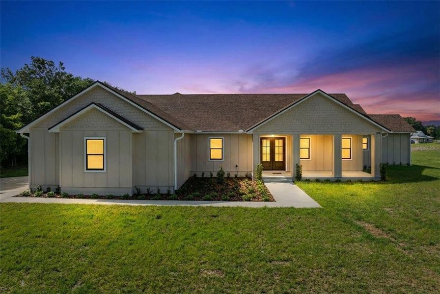 Front exterior of a new home in , Yeehaw Junction, FL, highlighting curb appeal (Image 22).