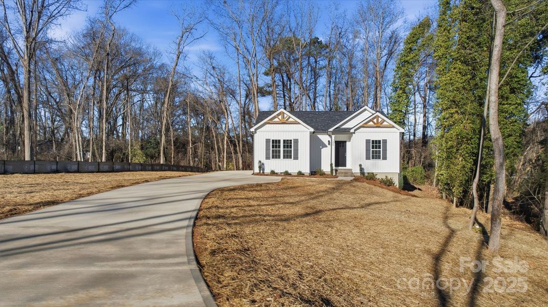 Front exterior of a new home in , Monroe, NC, highlighting curb appeal (Image 16).