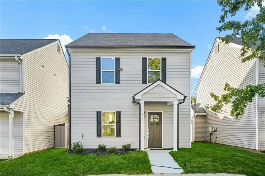 Front exterior of a new home in , Stockbridge, GA, highlighting curb appeal (Image 2). Front exterior of a new home in , Stockbridge, GA, highlighting curb appeal (Image 2).