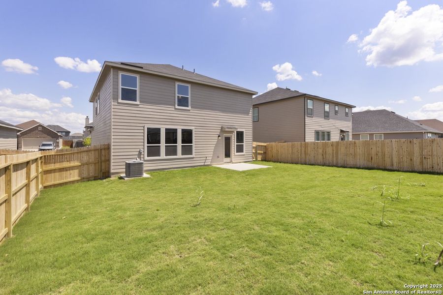Front exterior of a new home in Woodside Farms, Seguin, TX, highlighting curb appeal (Image 2). Front exterior of a new home in Woodside Farms, Seguin, TX, highlighting curb appeal (Image 2).