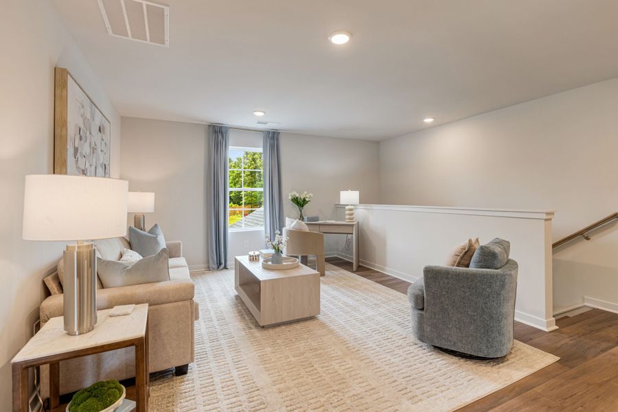 A living room with a couch and a table.