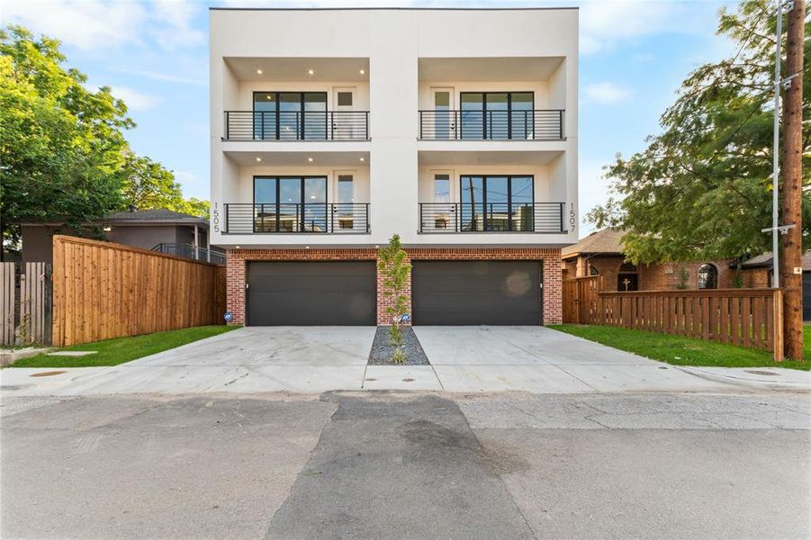Modern facade with white stucco and brick accents Modern facade with white stucco and brick accents