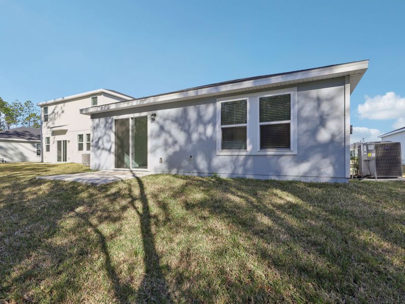 Exterior details and patio area of a home in Flagler Village - Classic Series, Palm Coast (Image 3).