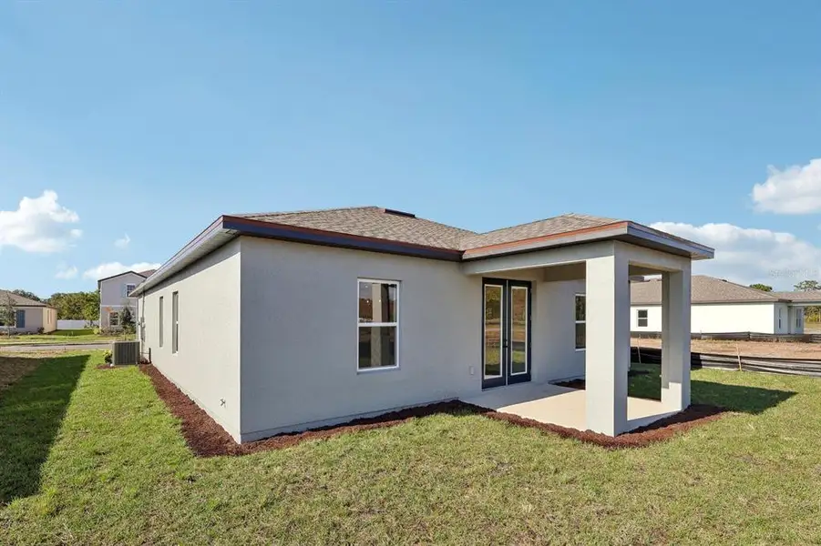 Exterior details and patio area of a home in Tyson Reserve, St. Cloud (Image 4).