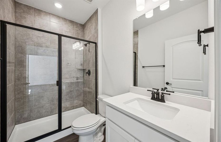 Secondary bath featuring a walk-in shower Secondary bath featuring a walk-in shower