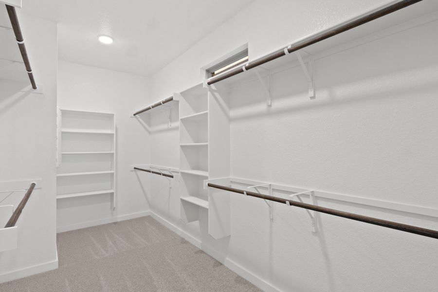 Primary Closet in the Willow home plan by Trophy Signature Homes – REPRESENTATIVE PHOTO