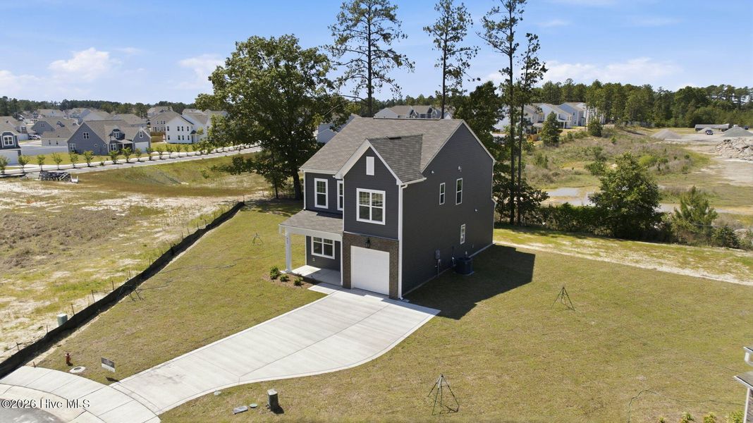 Front exterior of a new home in Sandy Springs, Aberdeen, NC, highlighting curb appeal (Image 18).