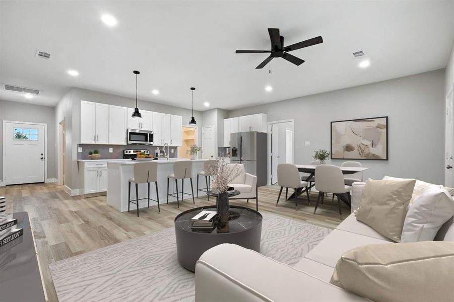 Virtually staged living area featuring light wood-style flooring, ceiling fan, and recessed lighting Virtually staged living area featuring light wood-style flooring, ceiling fan, and recessed lighting