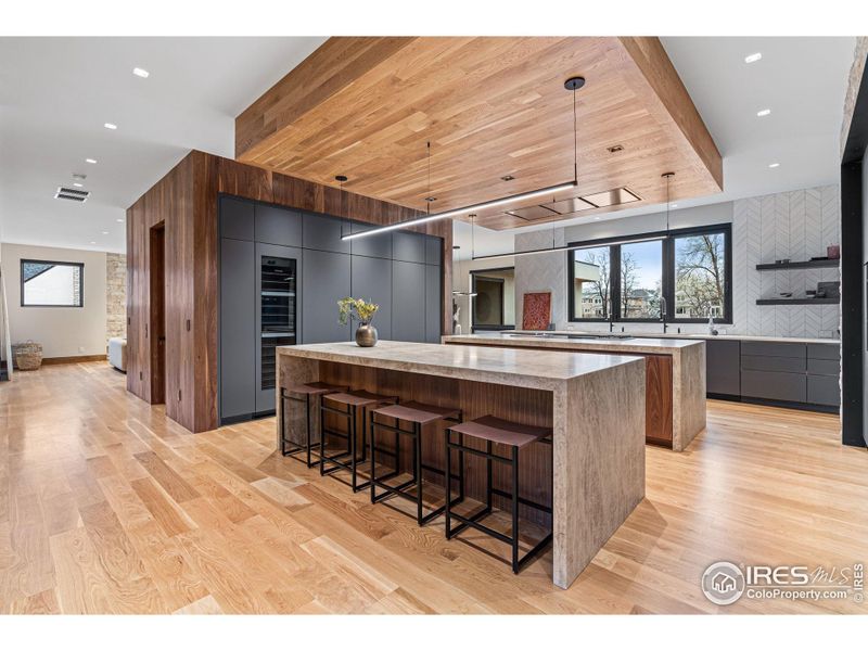 Entertainers dream kitchen designed to elevate your hosting experience. Leathered quartz countertops, Eclipse by Shiloh Cabinetry and cabinet-faced top of the line Miele appliances.