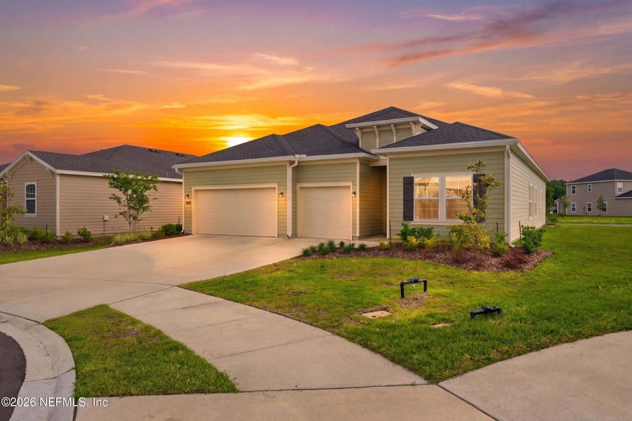 Front exterior of a new home in Saddle Oaks, Jacksonville, FL, highlighting curb appeal (Image 24). Front exterior of a new home in Saddle Oaks, Jacksonville, FL, highlighting curb appeal (Image 24).