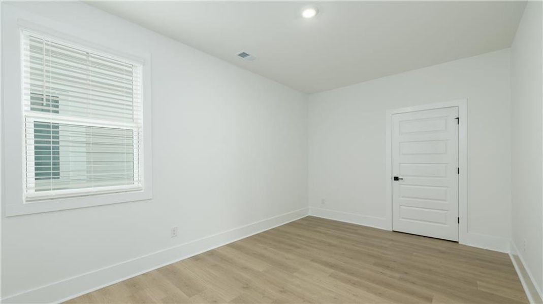 Spacious, unfurnished interior of a new home in The Village at Sandy Plains, Marietta (Image 16).