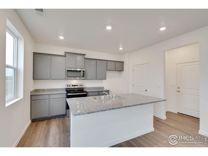 Furnished interior view inside a new home in Silver Peaks, Lochbuie (Image 7).