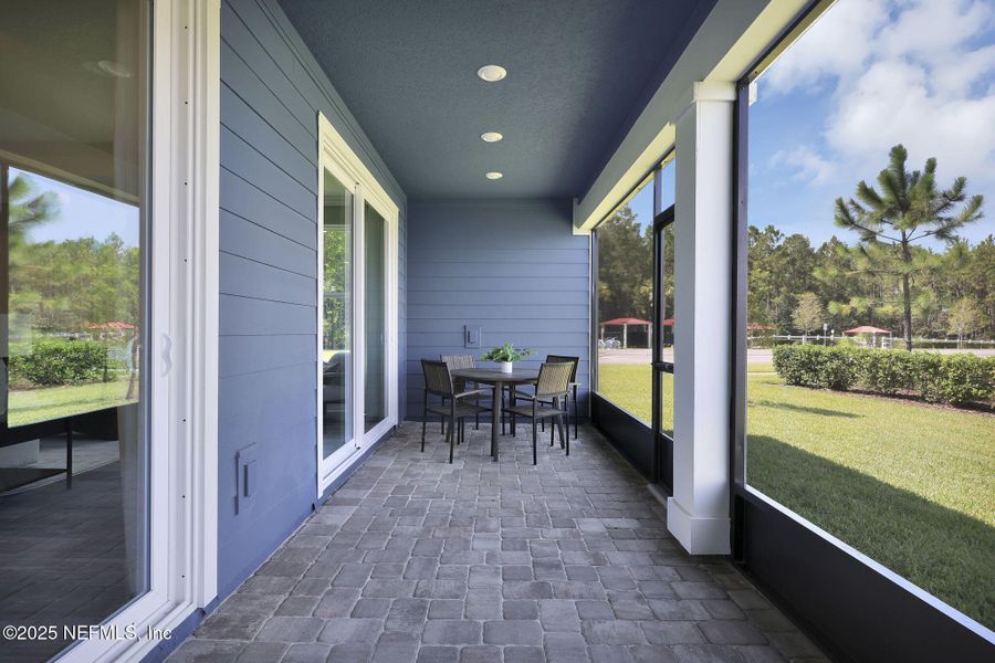 Exterior details and patio area of a home in The Preserve at Bannon Lakes, St. Augustine (Image 2).