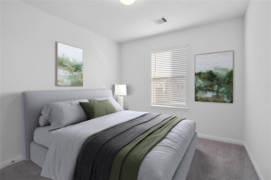 Secondary bedroom features plush carpet, neutral paint, lighting, large window with privacy blinds and ample sized closet space.