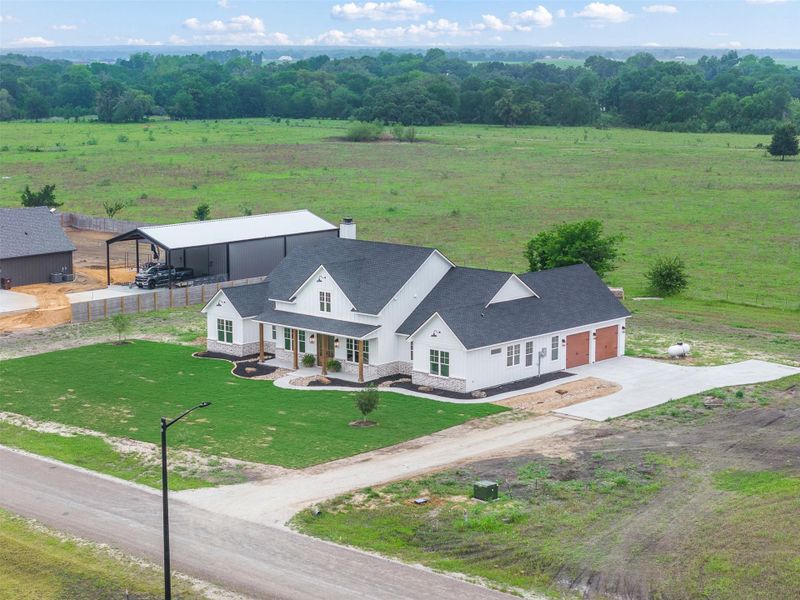 Front exterior of a new home in , Snook, TX, highlighting curb appeal (Image 28). Front exterior of a new home in , Snook, TX, highlighting curb appeal (Image 28).