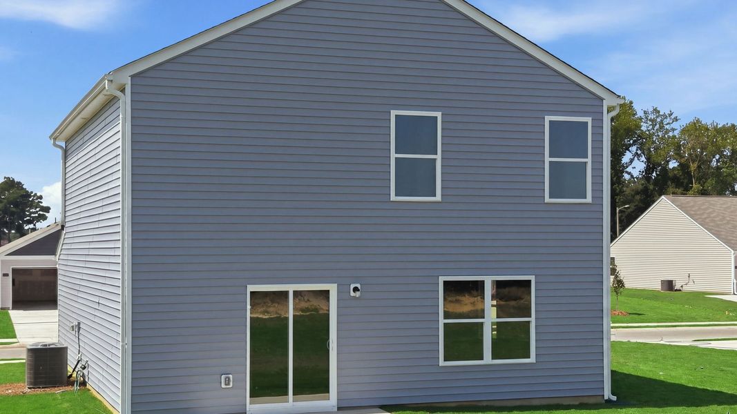 Exterior details and patio area of a home in Hobbs Farm, Ayden (Image 23).