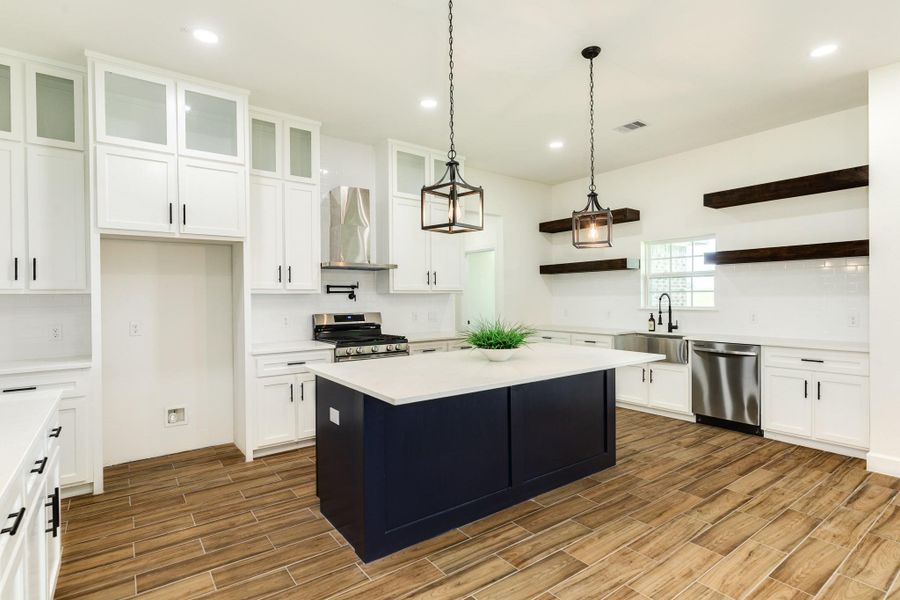 Cabinet's galore and floating shelves to highlight your special pieces. Large center island