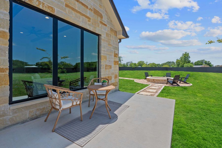 View of patio featuring a fire pit