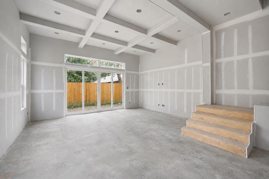 Architectural coffered ceiling adds character and dimension to the spacious living area. Architectural coffered ceiling adds character and dimension to the spacious living area.