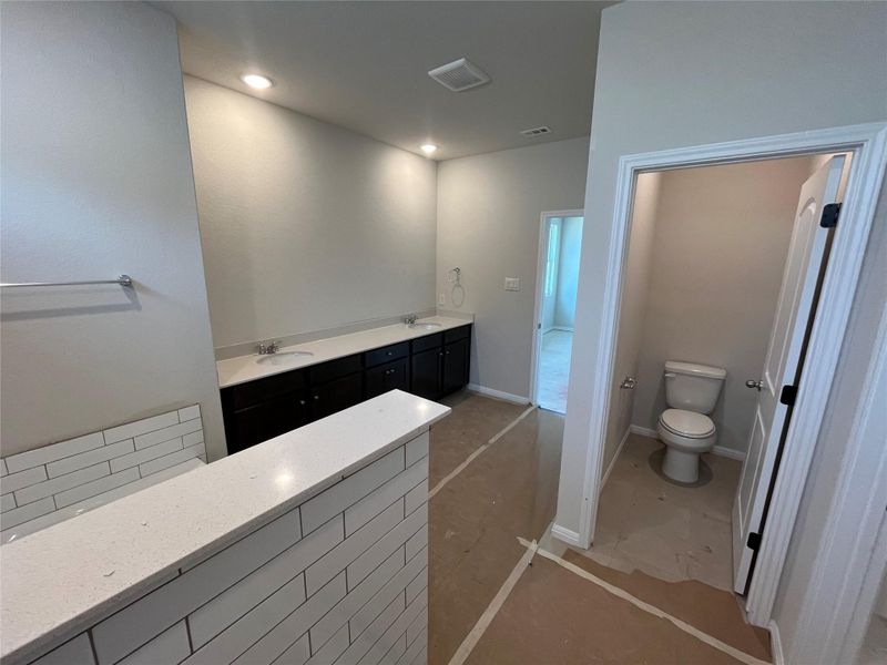 In-progress construction of a new home in The Cottages at Lariat, Liberty Hill, TX (Image 18).