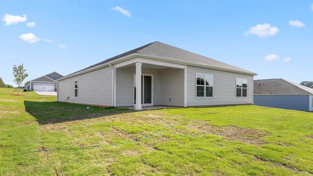 Exterior details and patio area of a home in Madeline Farm, New Bern (Image 4).