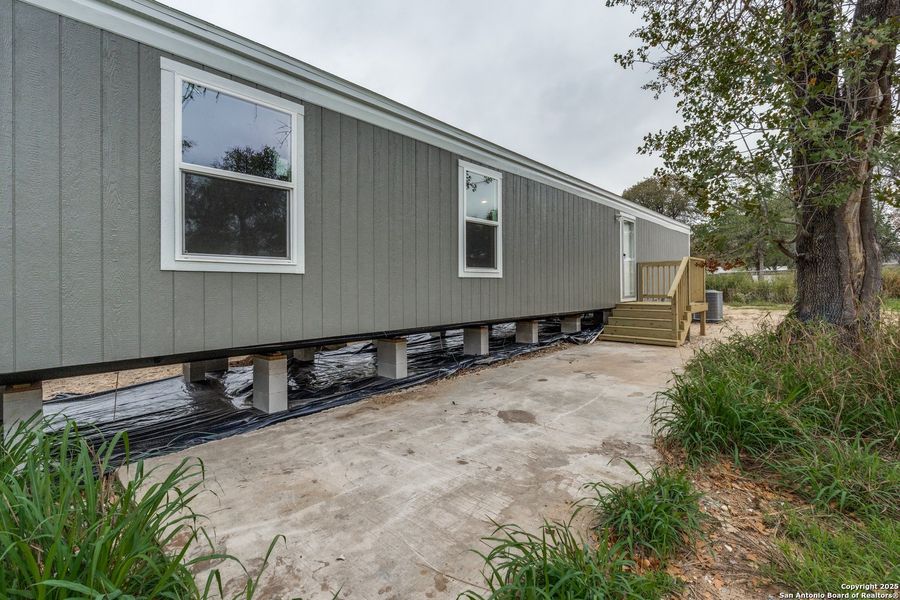 Exterior details and patio area of a home in , Elmendorf (Image 2). Exterior details and patio area of a home in , Elmendorf (Image 2).