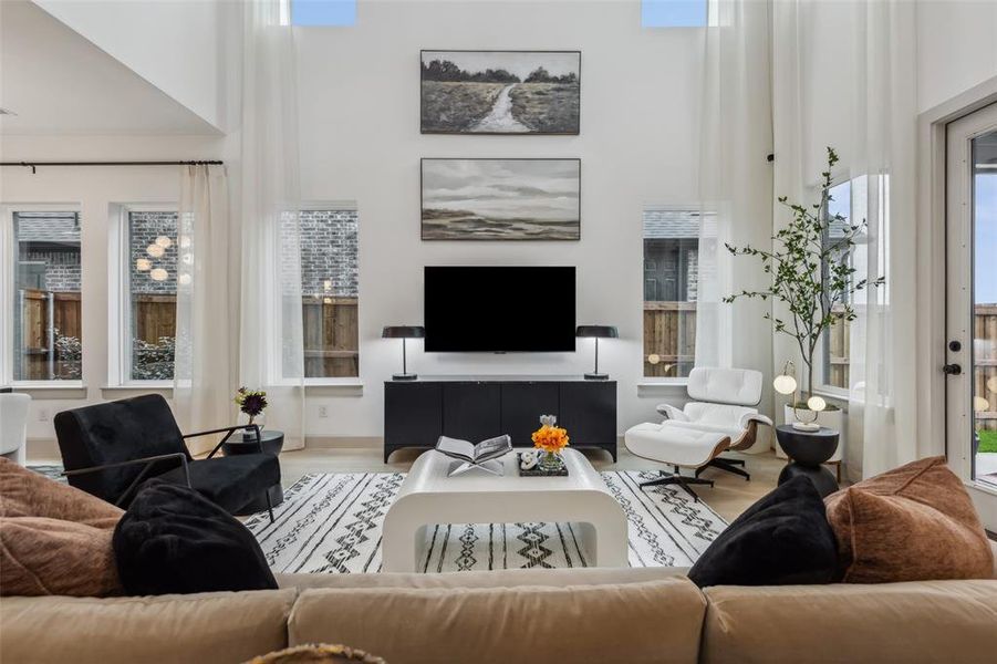 This two story family room offers an impressive space to host family and friends!