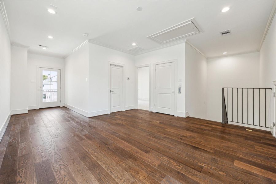 Third-floor game room with secondary bedroom and bath.