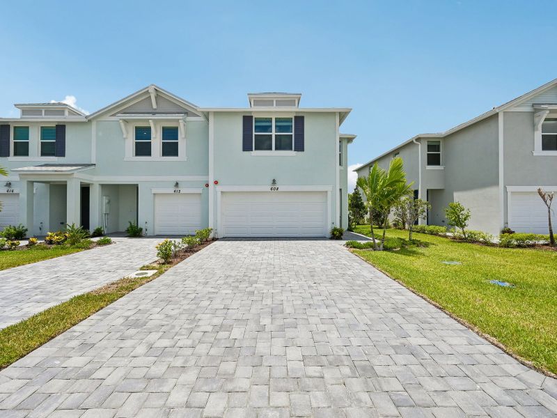 Front exterior of a new home in Tidewater, Fort Pierce, FL, highlighting curb appeal (Image 2). Front exterior of a new home in Tidewater, Fort Pierce, FL, highlighting curb appeal (Image 2).