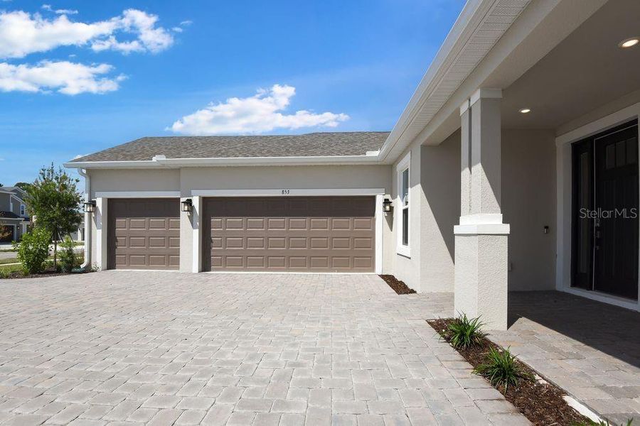 Front exterior of a new home in Ardisia Park, New Smyrna Beach, FL, highlighting curb appeal (Image 25).