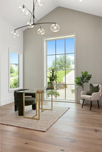 Sun-drenched study with soaring vaulted ceilings and expansive windows framing green outdoor views.