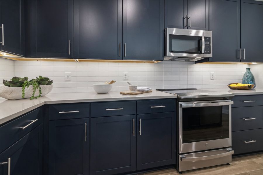 Kitchen with white tile backsplash